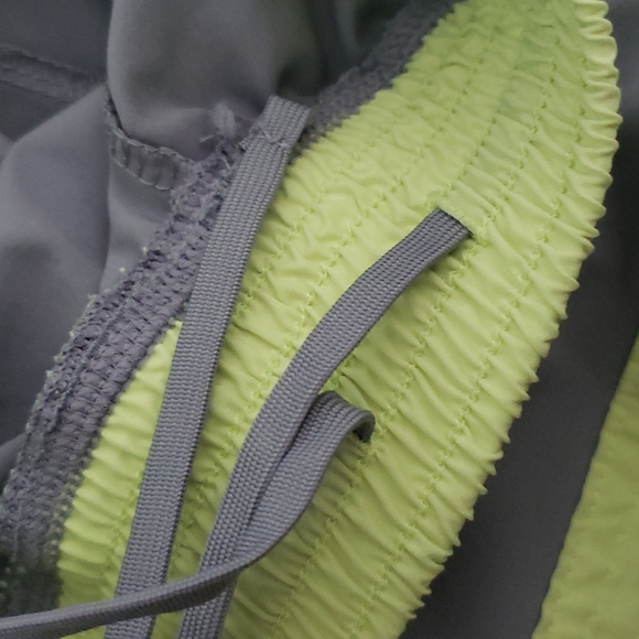 Size small Grey althetic shorts with yellow accents. No outside damage - Picture 3 of 4